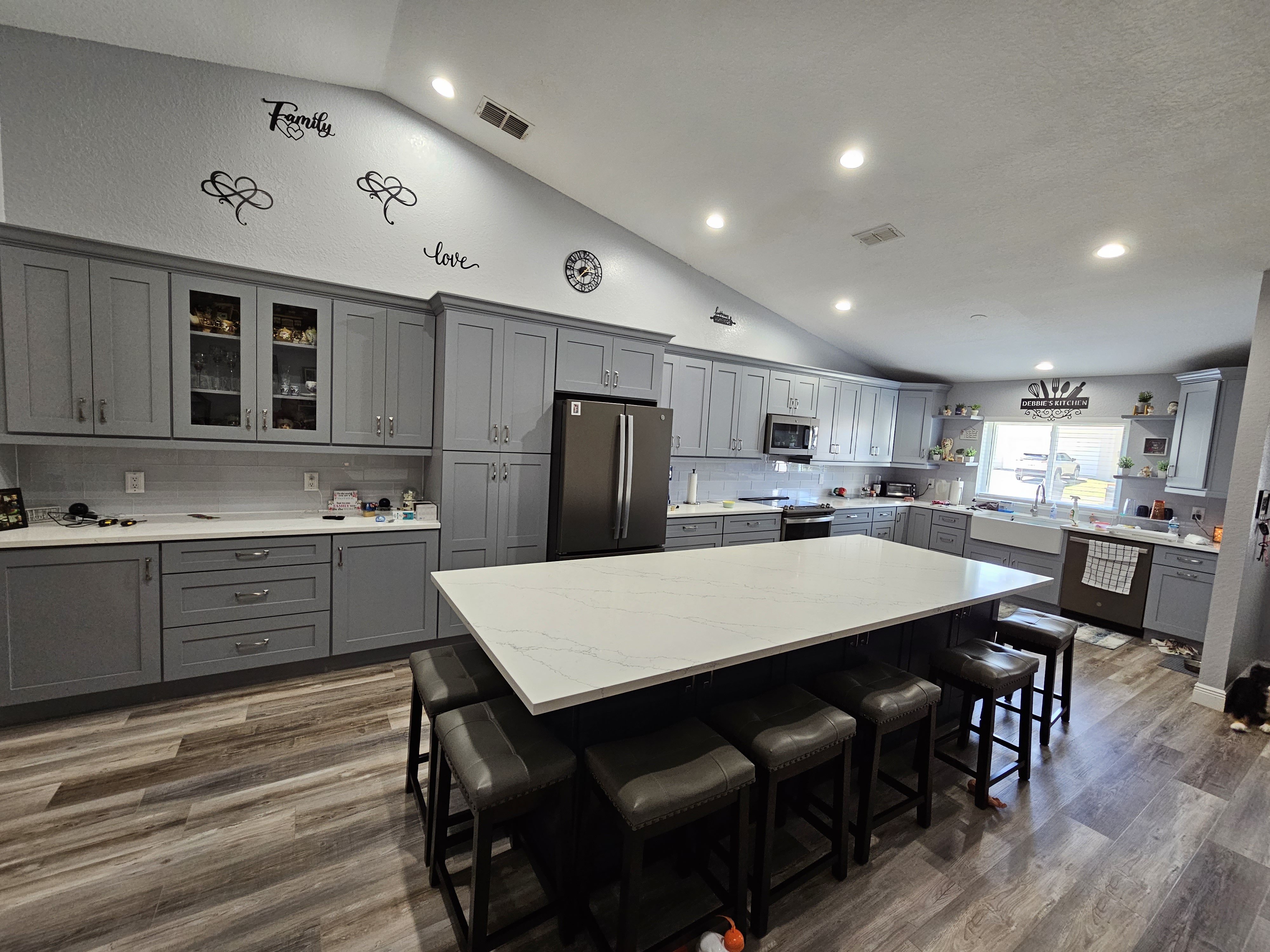 Grey and navy island kitchen with premium cabinetry