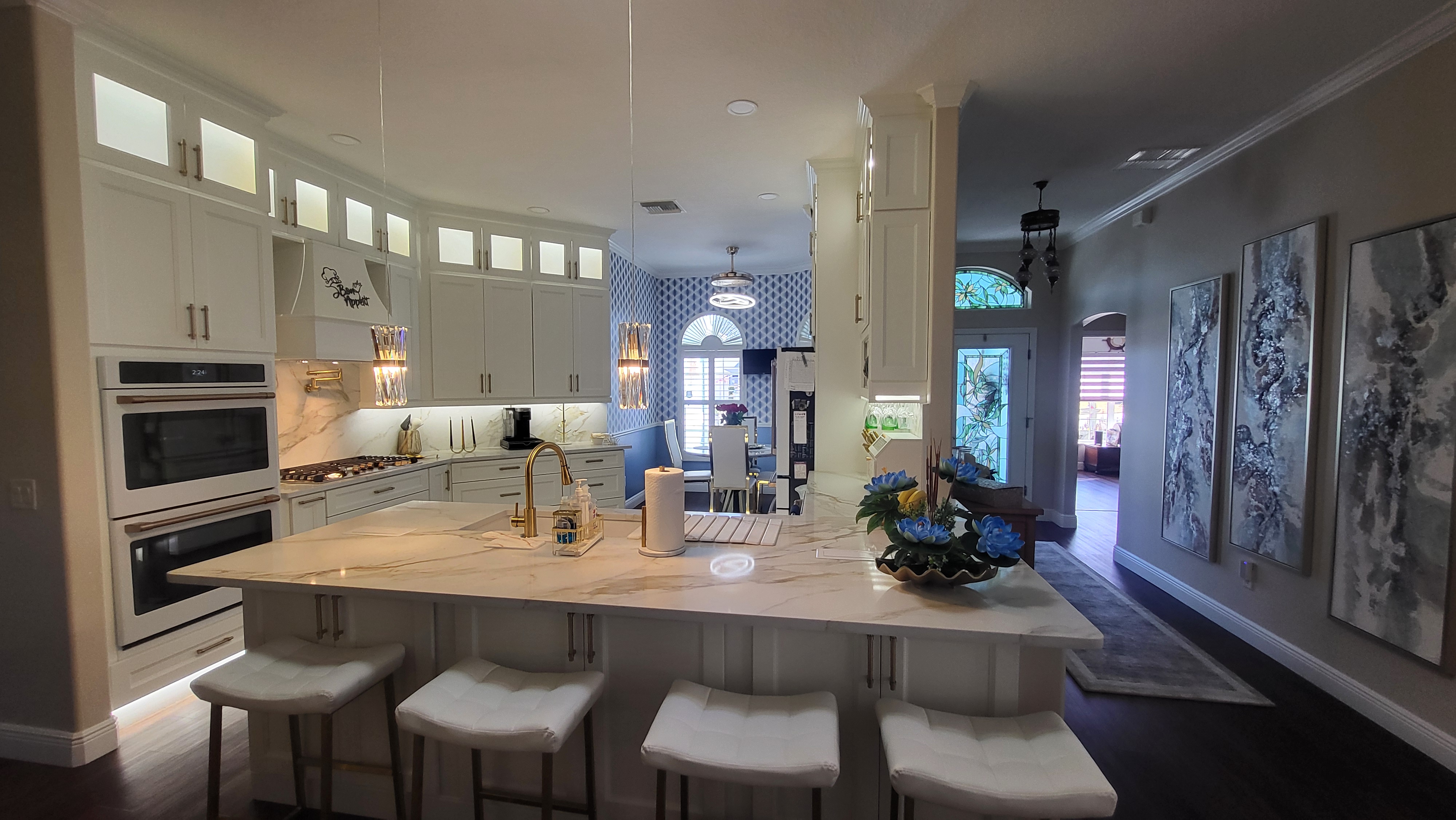 Premium white tower kitchen cabinetry with blue accent