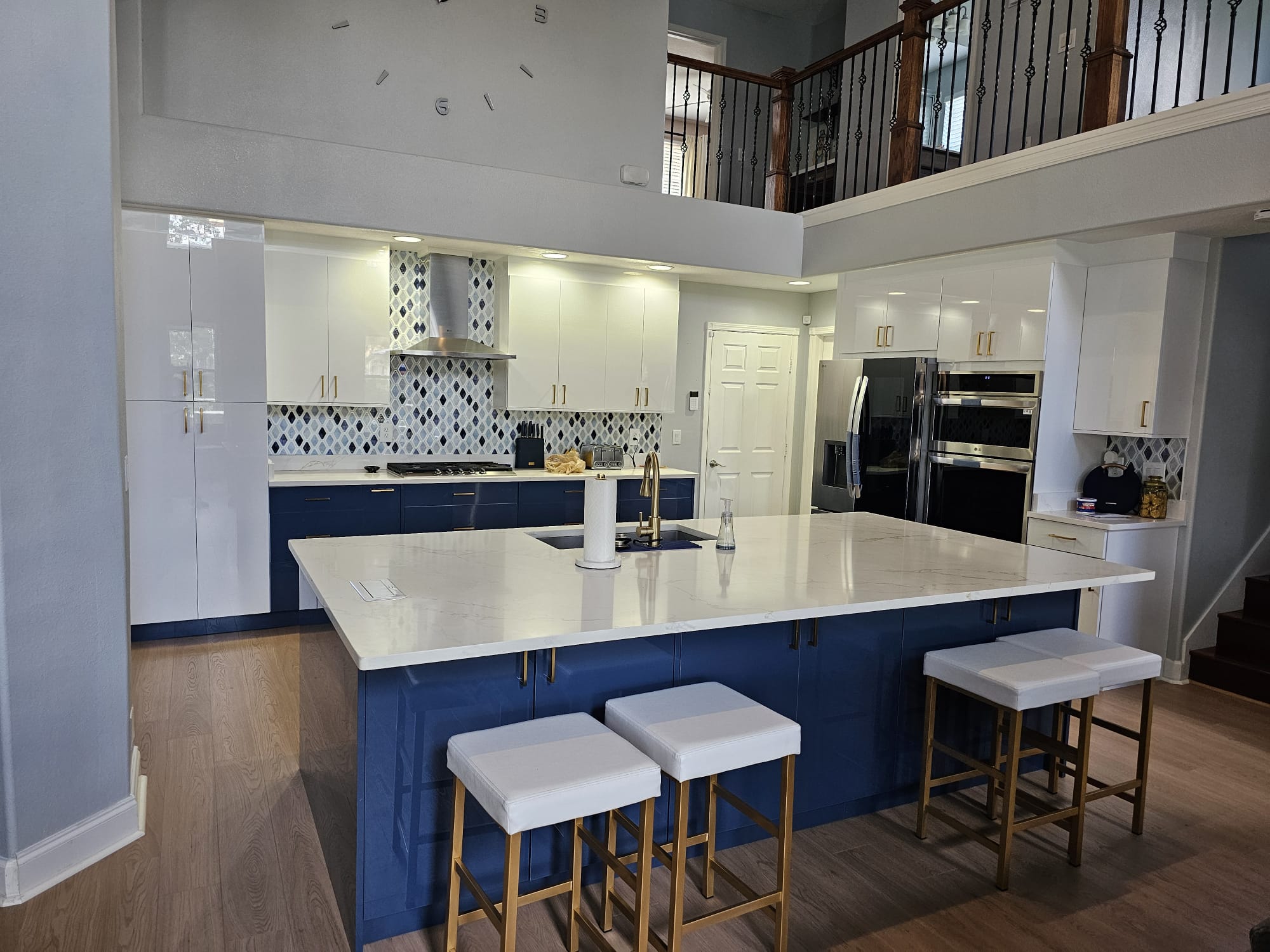 Modern white and navy multifamily kitchen with island